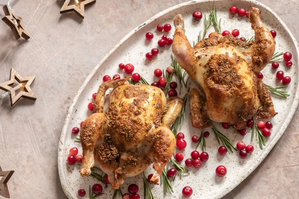 Two whole roasted chicken with cranberries and orange slices. — Stock Photo, Image