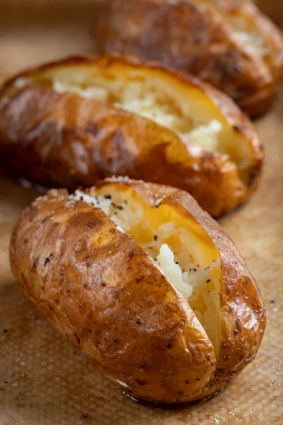 Hot buttered jacket baked potatoes — Stock Photo, Image