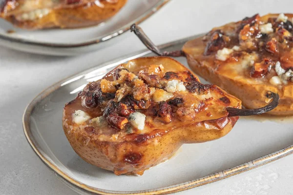 Pear baked with blue cheese, nuts and honey, — Stock Photo, Image