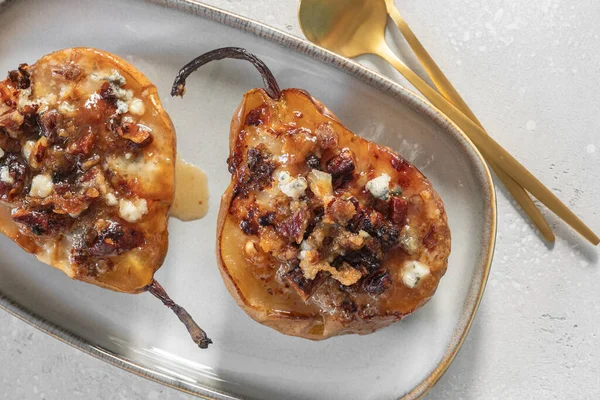 Pear baked with blue cheese, nuts and honey, — Stock Photo, Image