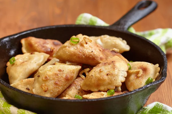 Dumplings fried with onion — Stock Photo, Image