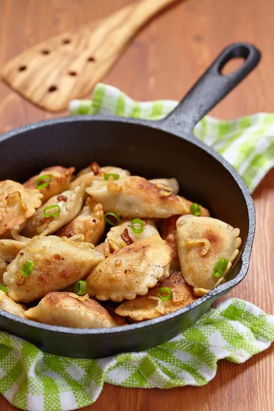 Dumplings fried with onion — Stock Photo, Image