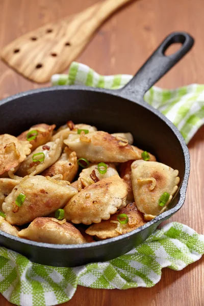 Dumplings fried with onion — Stock Photo, Image