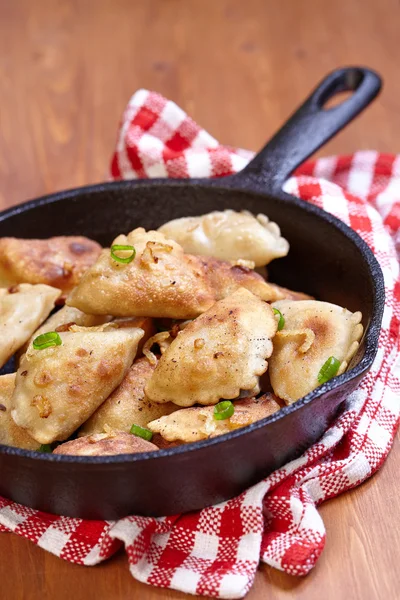 Dumplings fried with onion — Stock Photo, Image