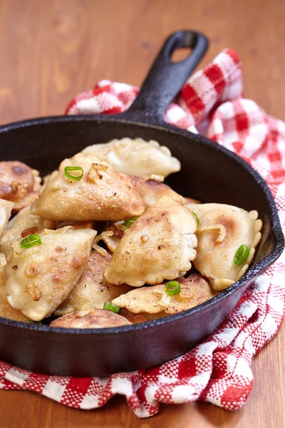 Dumplings fried with onion — Stock Photo, Image