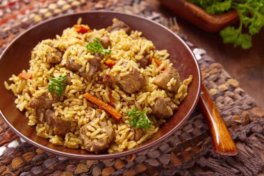 pilaf with meat and vegetables clipart