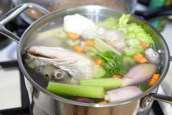 Cooking fish broth with vegetables — Stock Image Cooking fish broth with vegetables Stock Image