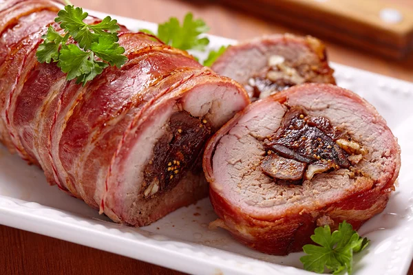 Roasted pork stuffed with figs and walnuts — Stock Photo, Image