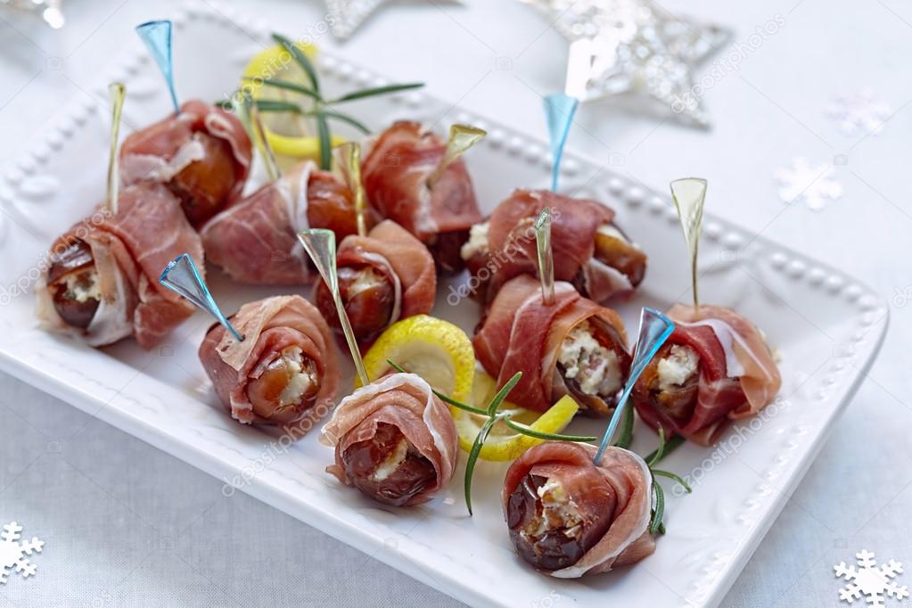 Dates stuffed cheese and wrapped prosciutto