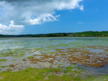 The sky is a vibrant blue with scattered clouds.