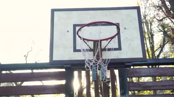 Basketball Backboard Sunbeam Old Torn Net Hoop Empty Playground Morning — Stock Video