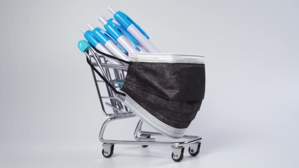 Shopping Cart Bunch Blue White Ballpoint Pens Buttons White Background — Stock Video