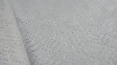 Gri kağıt peçetenin kabartmalı dokusu. Makro. Doli Vuruşu