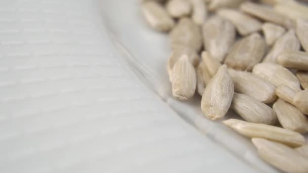 Healthy Peeled Dried Sunflower Seeds Fall Slow Motion White Plate — Stock Video