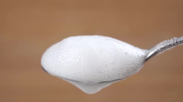 Thick Frothy Milky White Foam Teaspoon Macro Shot Wood Background — Stock Video