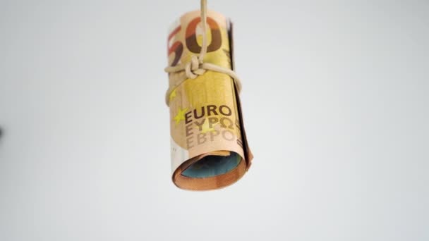 Roll European Cash Banknotes Tied Elastic Band Swinging White Background — Stock Video