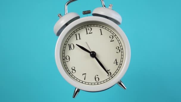 Alarm Clock Rotates Close Colored Blue Background — Stock Video