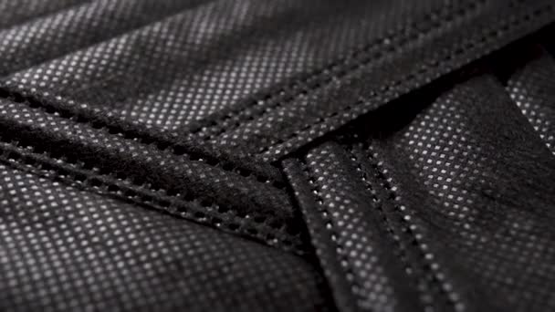 Abstrakte Schwarze Textur Medizinischer Schutzmasken Gestapelt Recycling Zeichen Makroschuss Rotation — Stockvideo