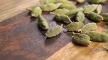 Green dry cardamom seeds. Macro