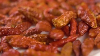 Cayenne piripiri red spicy pepper. Falling and rotating. Macro. Slow motion