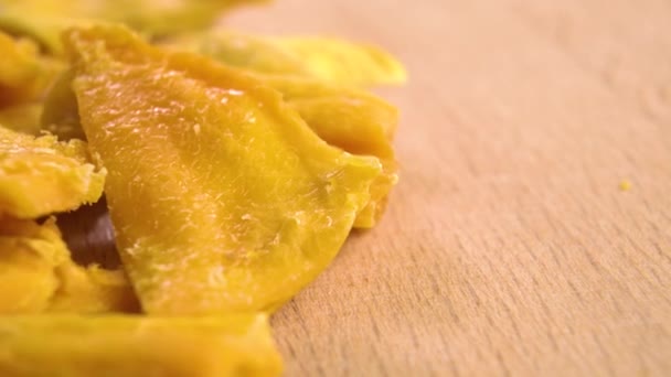 Dry Ripe Mango Wooden Textured Surface Macro Dolly Shot — Wideo stockowe