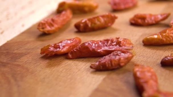 Dried Red Hot Cayenne Piripiri Peppers Falling Wooden Surface Slow — Vídeo de Stock