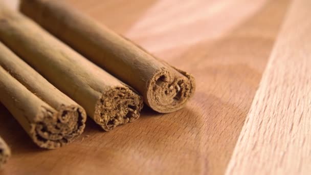 Cinnamon Sticks Wooden Surface Macro Dolly Shot — Stock Video