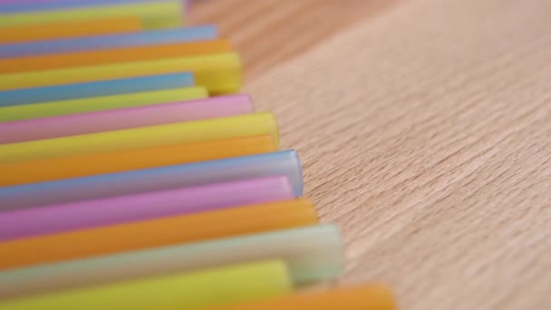 Colored Colorful Drinking Plastic Straws Wooden Surface Material Recycling Concept — Stok video