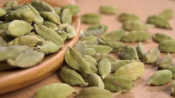 Full Wooden Spoon Dried Green Cardamom Textured Wood Surface Macro — Video