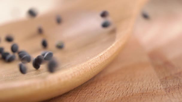 Black Raw Lentils Fall Fill Wooden Spoon Slow Motion Uncooked — Stock Video