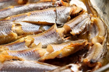 Fried blue whiting fish close-up ready to eat
