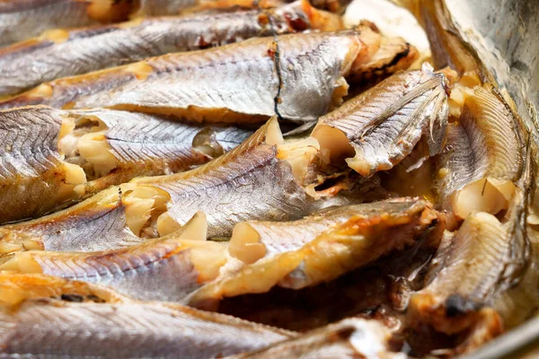 Fried blue whiting fish close-up ready to eat