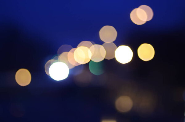 Defocused shot of city lights at evening
