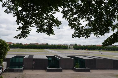 underground building entrance and green lawns on top