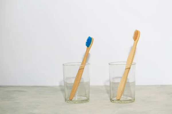 Eco Bamboo Tooth Brushes Two Glasses Oin White Background Concept — Stock Photo, Image