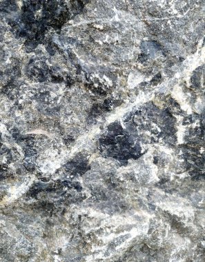 Taş bir dokunun görüntüsü. Arka plan için doku. Tasarımınız için doğal arkaplan.