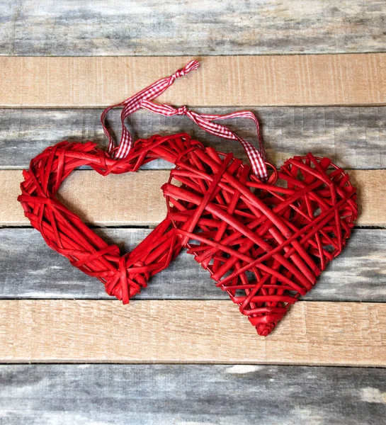 Wooden Background Two Ornaments Form Red Hearts Made Wire Straw — Stock Photo, Image
