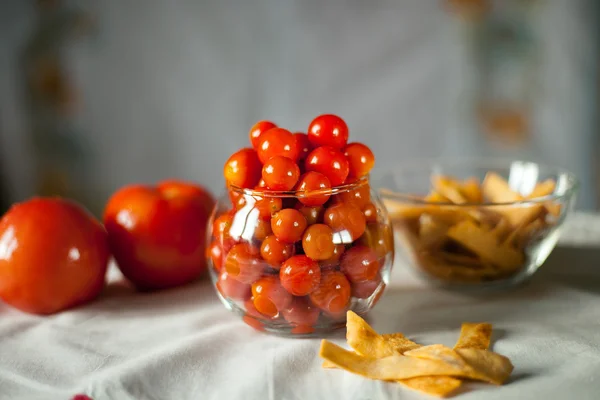 Still small preserved cherry tomatoes in a glass vase — Stock Photo, Image