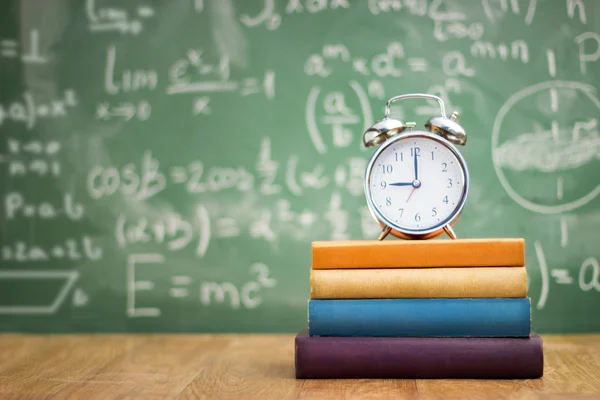 Back to school, books and an alarm clock — Stock Photo, Image
