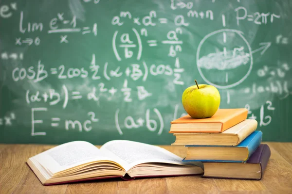 Stack of books in classroom — Stock Photo, Image