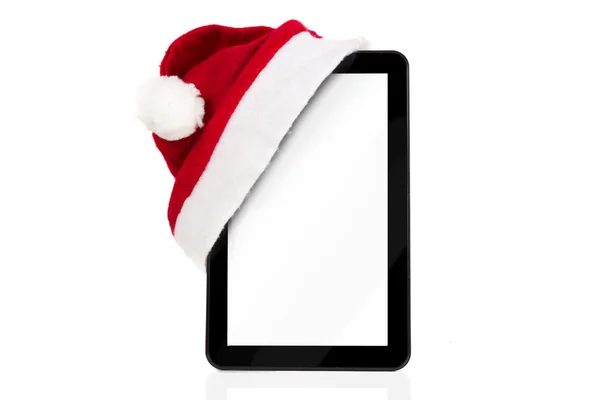 Vánoční tablet s Santa hat — Stock fotografie