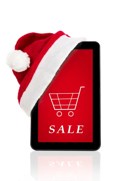 Rode kerstmuts op tablet, Kerstmis verkoop — Stockfoto