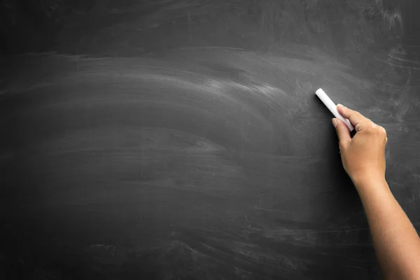 Hand schrijven op een schoolbord — Stockfoto