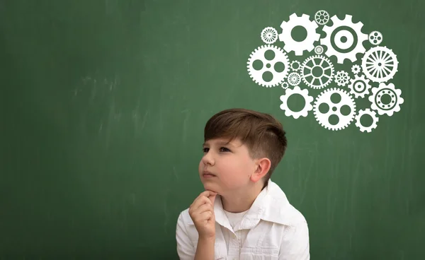 Thinking schoolboy with brainstorming Royalty Free Stock Photos