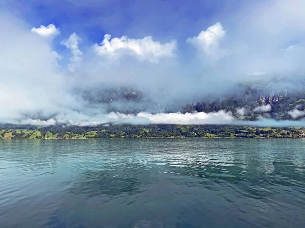 Morning fog and low clouds over Lake Brienz - Canton of Bern, Switzerland / Morgennebel und tiefe Wolken ueber dem Brienzersee, Brienz (Kanton Bern, Schweiz)