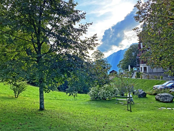 A park with a garden and green areas next to the Grand Hotel Giessbach above Lake Brienz (Brienzersee) - Canton of Bern, Switzerland (Kanton Bern, Schweiz)