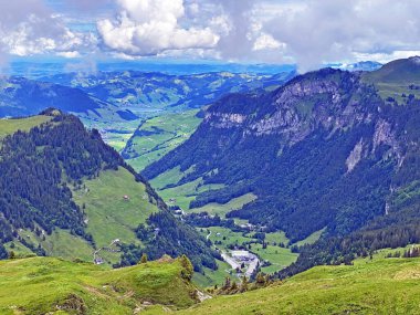 View of the Loch alpine valley over the Iberig region and below the foot of a mountain range First, Oberiberg - Canton of Schwyz, Switzerland (Kanton Schwyz, Schweiz)