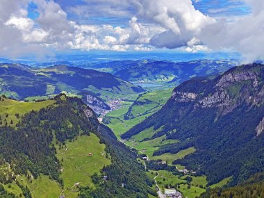 View of the Loch alpine valley over the Iberig region and below the foot of a mountain range First, Oberiberg - Canton of Schwyz, Switzerland (Kanton Schwyz, Schweiz)