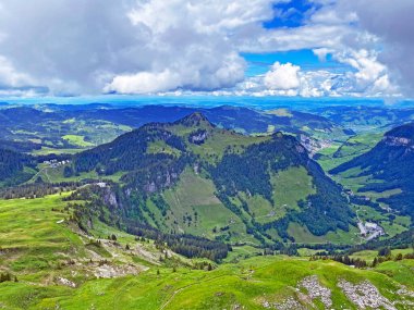 View of the Loch alpine valley over the Iberig region and below the foot of a mountain range First, Oberiberg - Canton of Schwyz, Switzerland (Kanton Schwyz, Schweiz)