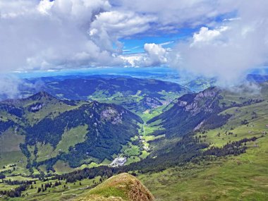 View of the Loch alpine valley over the Iberig region and below the foot of a mountain range First, Oberiberg - Canton of Schwyz, Switzerland (Kanton Schwyz, Schweiz)